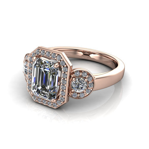 Wrenley emerald halo engagement ring in 18K Rose Gold, three-quarter perspective showing the haloed center raised above a slim polished band