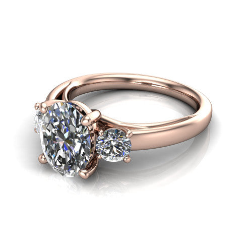 Alyssa oval classic engagement ring in 14K Rose Gold, three-quarter perspective showing the center diamond between two round side stones on a slim polished band