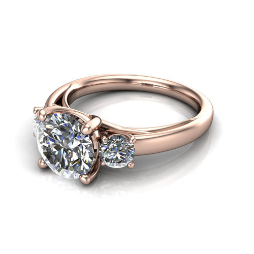 Alyssa round classic engagement ring in 18K Rose Gold, three-quarter perspective showing the center diamond between two round side stones on a slim polished band
