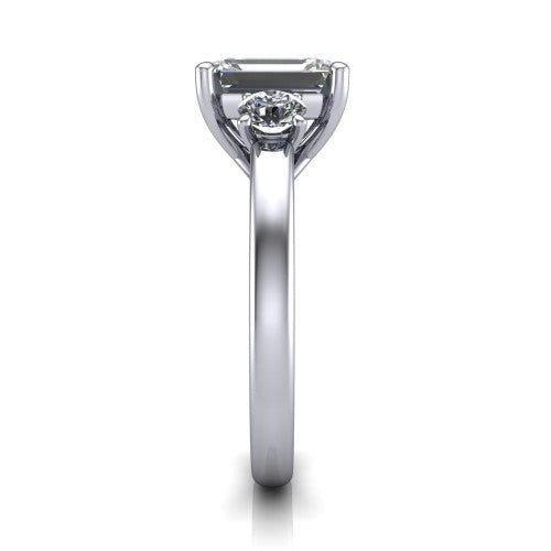 Alyssa emerald classic engagement ring in 18K White Gold, side profile showing the round side stone and the smooth tapered polished band