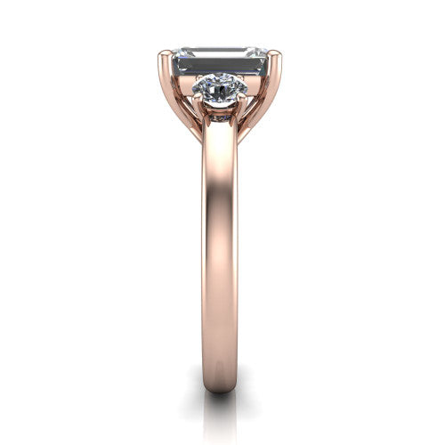 Alyssa emerald classic engagement ring in 14K Rose Gold, side profile showing the round side stone and the smooth tapered polished band