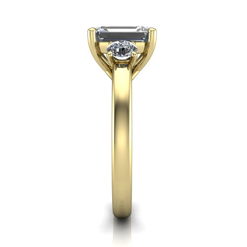Alyssa emerald classic engagement ring in 18K Yellow Gold, side profile showing the round side stone and the smooth tapered polished band