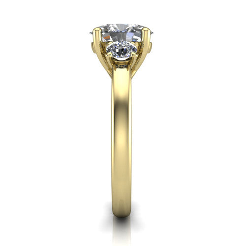 Alyssa oval classic engagement ring in 14K Yellow Gold, side profile showing the round side stone and the smooth tapered polished band