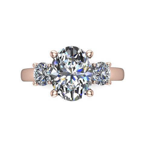 Alyssa oval classic engagement ring in 14K Rose Gold, top-down view showing the center diamond flanked by two round side stones in a classic three stone setting