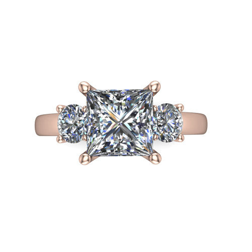 Alyssa princess classic engagement ring in 18K Rose Gold, top-down view showing the center diamond flanked by two round side stones in a classic three stone setting