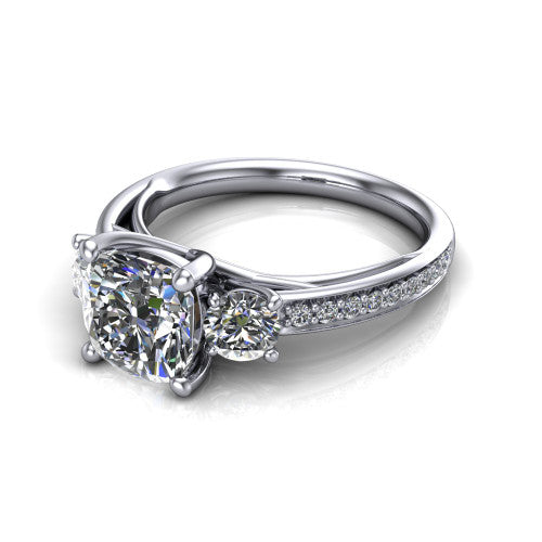 London cushion classic engagement ring in Platinum, three-quarter perspective showing the center diamond between two round side stones above a pav&eacute; shank