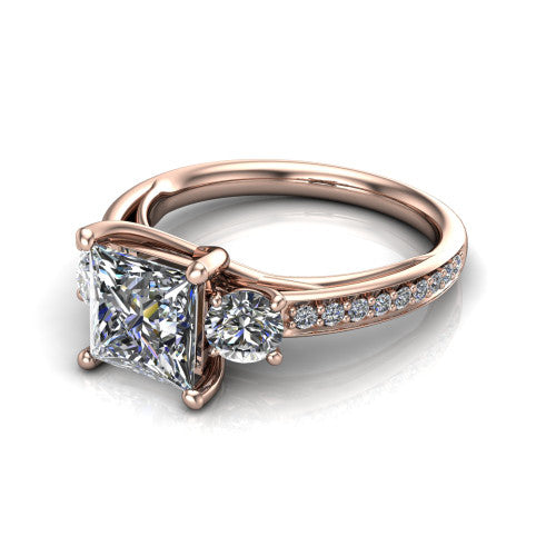 London princess classic engagement ring in 14K Rose Gold, three-quarter perspective showing the center diamond between two round side stones above a pav&eacute; shank