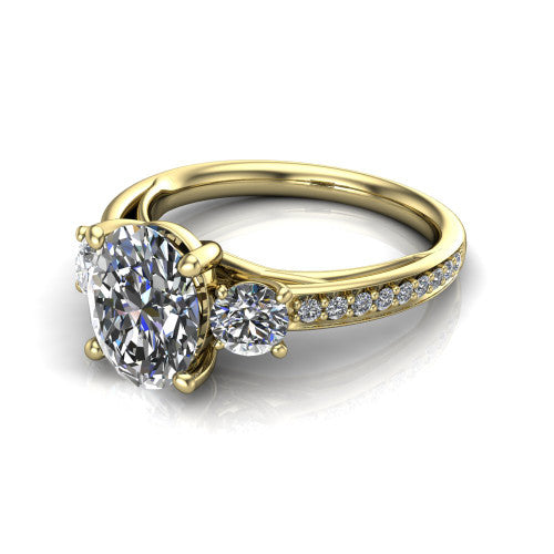 London oval classic engagement ring in 14K Yellow Gold, three-quarter perspective showing the center diamond between two round side stones above a pav&eacute; shank