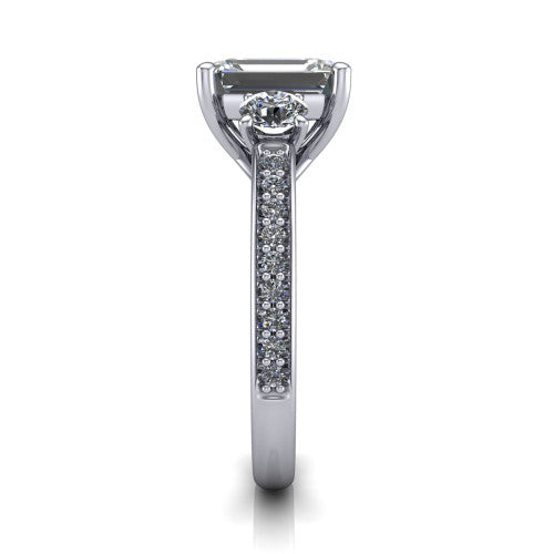 London emerald classic engagement ring in 14K White Gold, side profile showing the round side stone and the pav&eacute; diamonds running down the shank