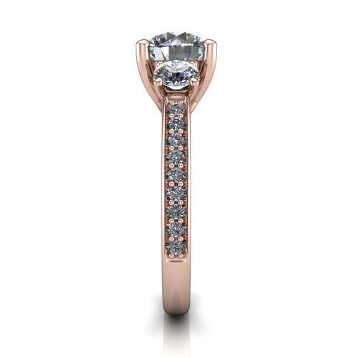 London round classic engagement ring in 18K Rose Gold, side profile showing the round side stone and the pav&eacute; diamonds running down the shank