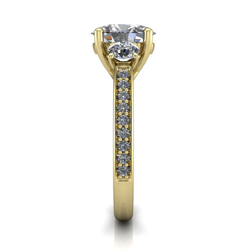 London oval classic engagement ring in 14K Yellow Gold, side profile showing the round side stone and the pav&eacute; diamonds running down the shank