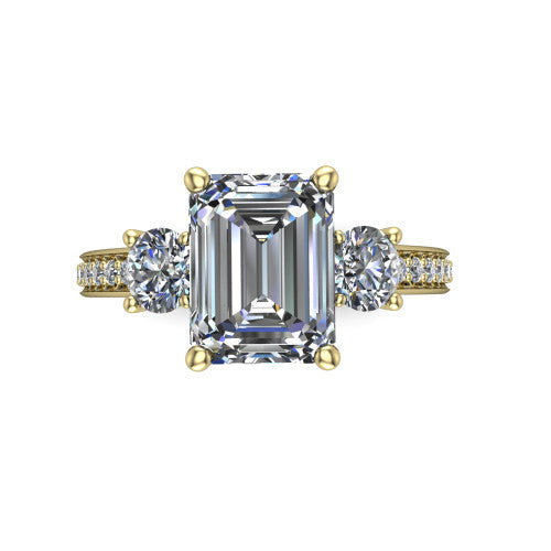 London emerald classic engagement ring in 18K Yellow Gold, top-down view showing the center diamond flanked by two round side stones in a classic three stone setting