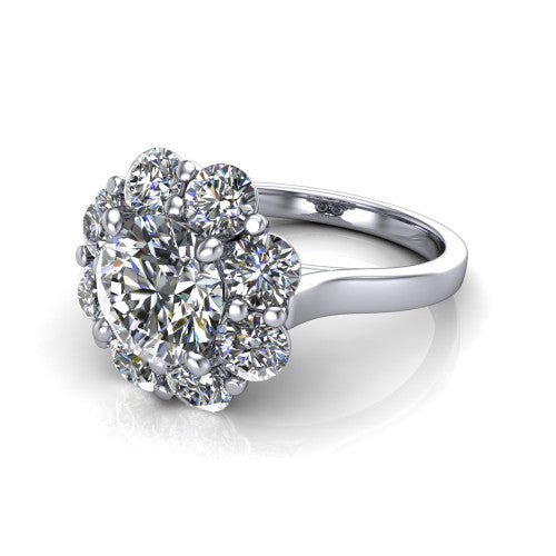 Gabriela round halo engagement ring in 18K White Gold, three-quarter perspective showing the center framed by a cluster halo of round diamonds above a slim polished band