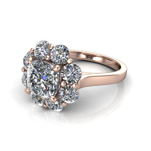 Gabriela cushion halo engagement ring in 14K Rose Gold, three-quarter perspective showing the center framed by a cluster halo of round diamonds above a slim polished band