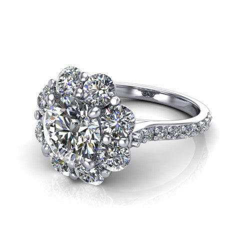 Brooklynn round halo engagement ring in Platinum, three-quarter perspective showing the center framed by a cluster halo of round diamonds above a pav&eacute; shank