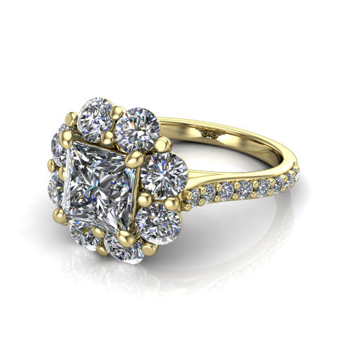Brooklynn princess halo engagement ring in 18K Yellow Gold, three-quarter perspective showing the center framed by a cluster halo of round diamonds above a pav&eacute; shank