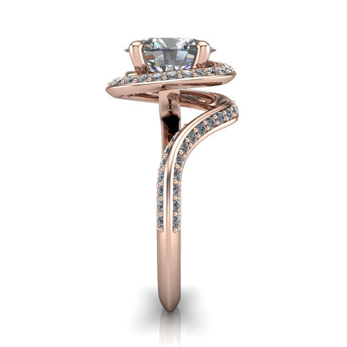 Paislee oval halo engagement ring in 14K Rose Gold, side profile showing the pav&eacute; halo spiraling into the twisting bypass shank