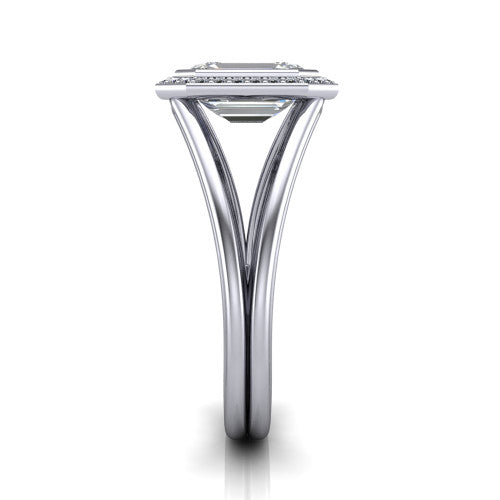 Tatum emerald halo engagement ring in Platinum, side profile showing the polished split shank dividing into two slim rails beneath the halo