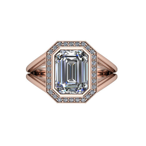 Tatum emerald halo engagement ring in 18K Rose Gold, top-down view showing the center diamond framed by a pav&eacute; halo where the split shank rails meet the head
