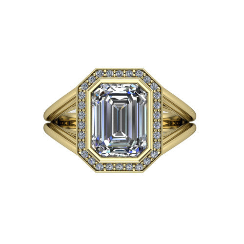 Tatum emerald halo engagement ring in 18K Yellow Gold, top-down view showing the center diamond framed by a pav&eacute; halo where the split shank rails meet the head