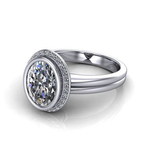 Maggie oval halo engagement ring in 14K White Gold, three-quarter perspective showing the bezel-set center framed by a pav&eacute; halo on a polished double-rail shank