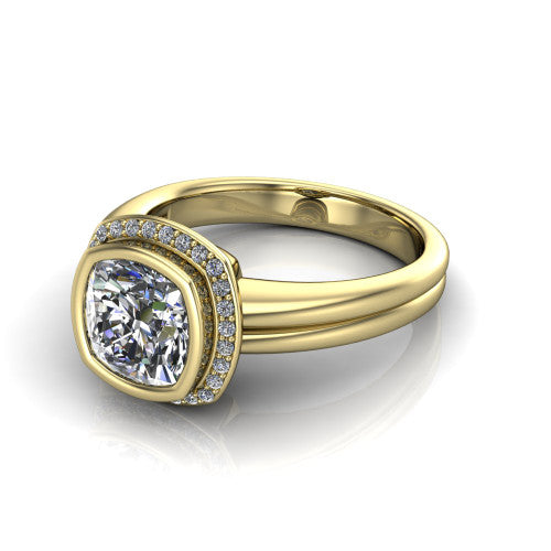 Maggie cushion halo engagement ring in 14K Yellow Gold, three-quarter perspective showing the bezel-set center framed by a pav&eacute; halo on a polished double-rail shank