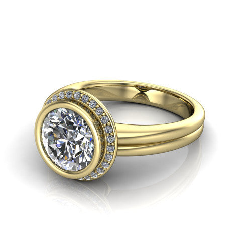 Maggie round halo engagement ring in 14K Yellow Gold, three-quarter perspective showing the bezel-set center framed by a pav&eacute; halo on a polished double-rail shank