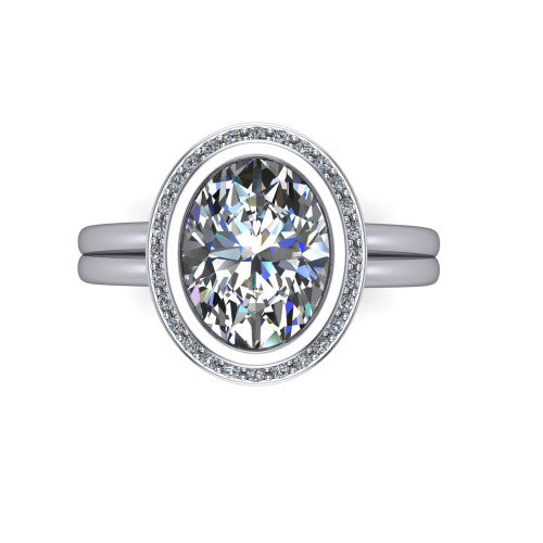Maggie oval halo engagement ring in Platinum, top-down view showing the center diamond ringed by the pav&eacute; halo and bezel frame