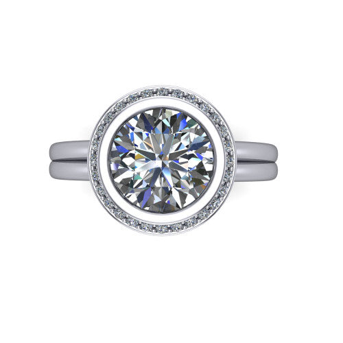 Maggie round halo engagement ring in 18K White Gold, top-down view showing the center diamond ringed by the pav&eacute; halo and bezel frame