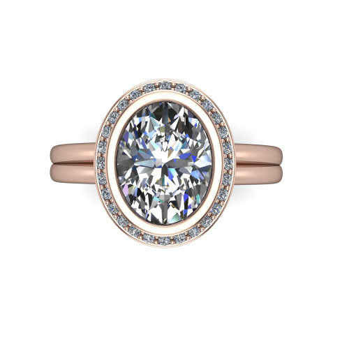 Maggie oval halo engagement ring in 14K Rose Gold, top-down view showing the center diamond ringed by the pav&eacute; halo and bezel frame