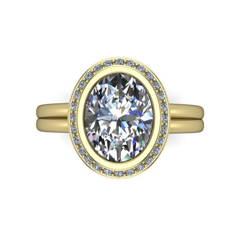 Maggie oval halo engagement ring in 14K Yellow Gold, top-down view showing the center diamond ringed by the pav&eacute; halo and bezel frame
