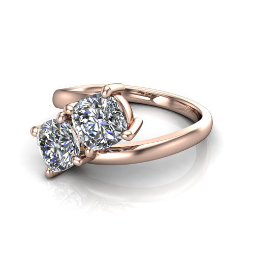 Adelaide cushion three stone engagement ring in 18K Rose Gold, three-quarter perspective showing two diamonds set corner to corner on a slim polished bypass band