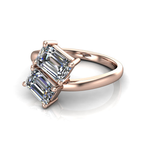 Adelaide emerald three stone engagement ring in 18K Rose Gold, three-quarter perspective showing two diamonds set corner to corner on a slim polished bypass band