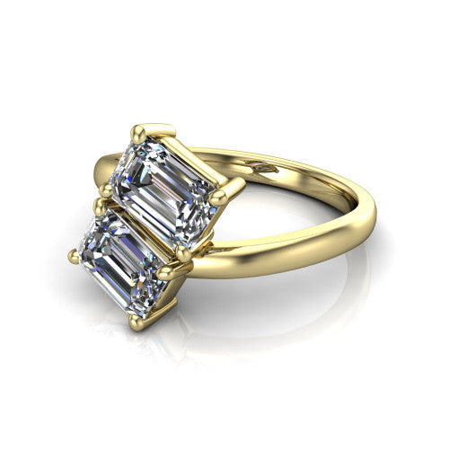 Adelaide emerald three stone engagement ring in 18K Yellow Gold, three-quarter perspective showing two diamonds set corner to corner on a slim polished bypass band