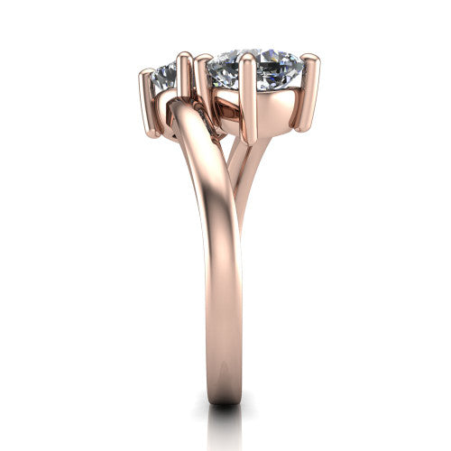 Adelaide cushion three stone engagement ring in 18K Rose Gold, side profile showing the slim single bypass band swirling beneath the two-stone head