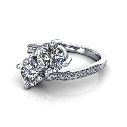Payton round three stone engagement ring in Platinum, three-quarter perspective showing two diamonds set corner to corner above a pav&eacute; bypass split shank