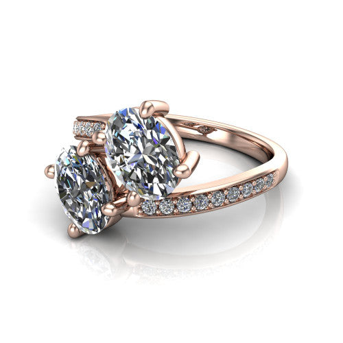 Payton oval three stone engagement ring in 18K Rose Gold, three-quarter perspective showing two diamonds set corner to corner above a pav&eacute; bypass split shank