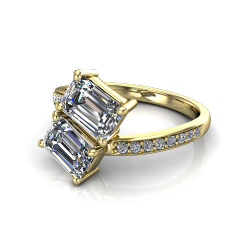 Payton emerald three stone engagement ring in 18K Yellow Gold, three-quarter perspective showing two diamonds set corner to corner above a pav&eacute; bypass split shank