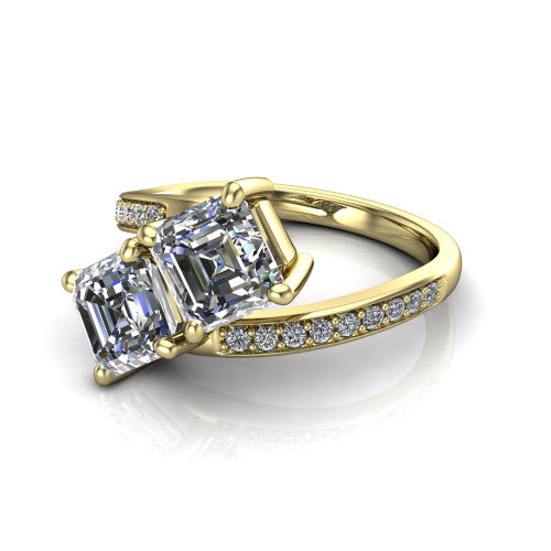 Payton asscher three stone engagement ring in 14K Yellow Gold, three-quarter perspective showing two diamonds set corner to corner above a pav&eacute; bypass split shank