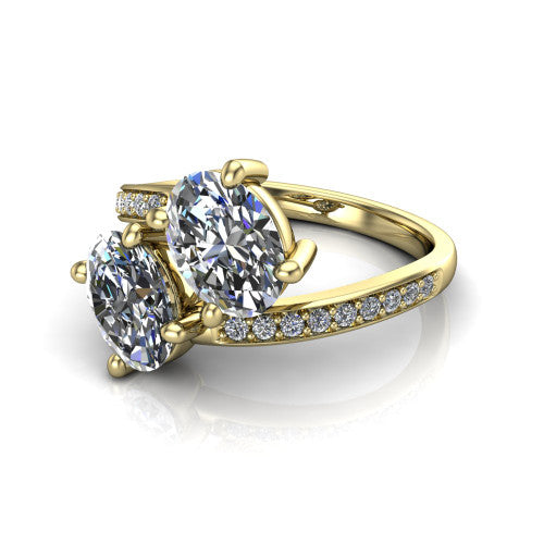 Payton oval three stone engagement ring in 18K Yellow Gold, three-quarter perspective showing two diamonds set corner to corner above a pav&eacute; bypass split shank