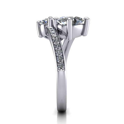 Payton oval three stone engagement ring in Platinum, side profile showing the pav&eacute; split shank crossing in a bypass beneath the two-stone head