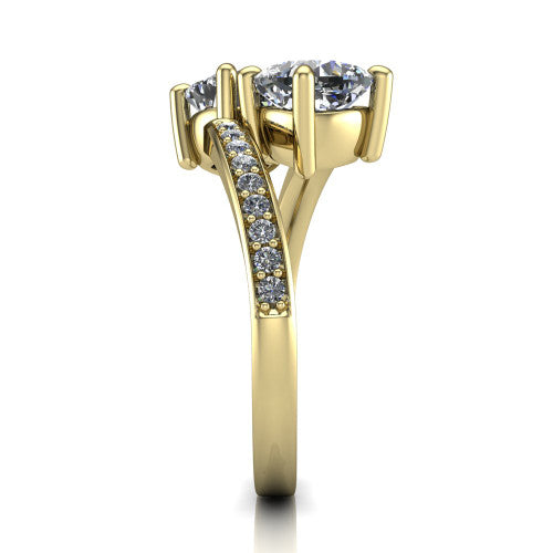 Payton cushion three stone engagement ring in 18K Yellow Gold, side profile showing the pav&eacute; split shank crossing in a bypass beneath the two-stone head