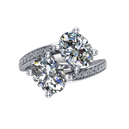 Payton oval three stone engagement ring in Platinum, top-down view showing the two diamonds in a toi et moi arrangement where the pav&eacute; split rails meet the head