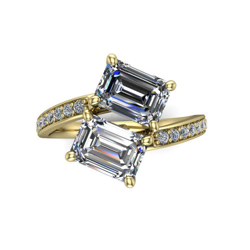 Payton emerald three stone engagement ring in 18K Yellow Gold, top-down view showing the two diamonds in a toi et moi arrangement where the pav&eacute; split rails meet the head