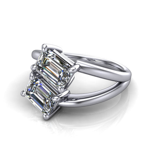 Michelle emerald three stone engagement ring in Platinum, three-quarter perspective showing two diamonds set corner to corner above an open polished split shank