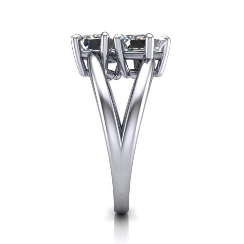 Michelle emerald three stone engagement ring in 18K White Gold, side profile showing the polished split shank dividing into two rails beneath the two-stone head