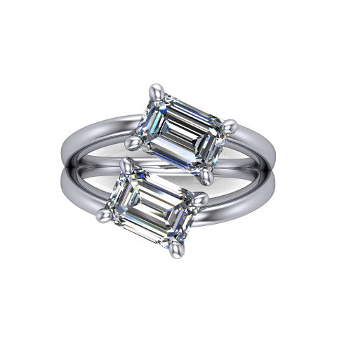Michelle emerald three stone engagement ring in 18K White Gold, top-down view showing the two diamonds in a toi et moi arrangement where the split shank rails meet the head