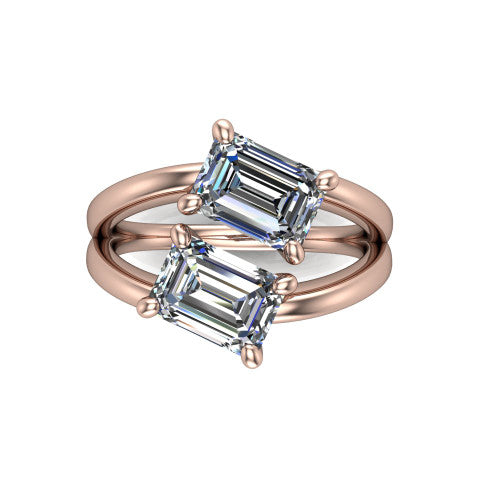 Michelle emerald three stone engagement ring in 14K Rose Gold, top-down view showing the two diamonds in a toi et moi arrangement where the split shank rails meet the head