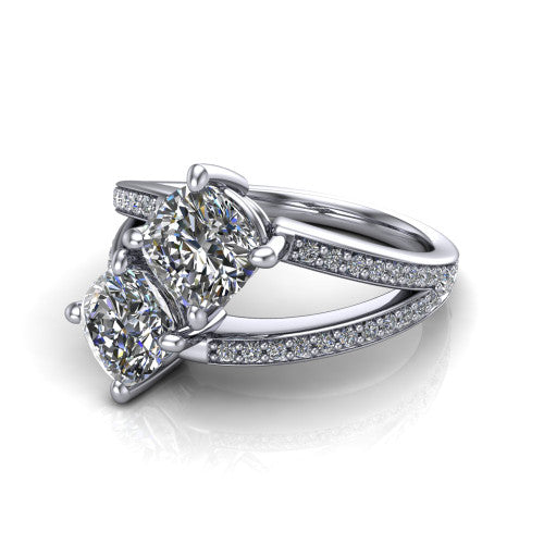 Malani cushion three stone engagement ring in Platinum, three-quarter perspective showing two diamonds set corner to corner above a pav&eacute; split shank