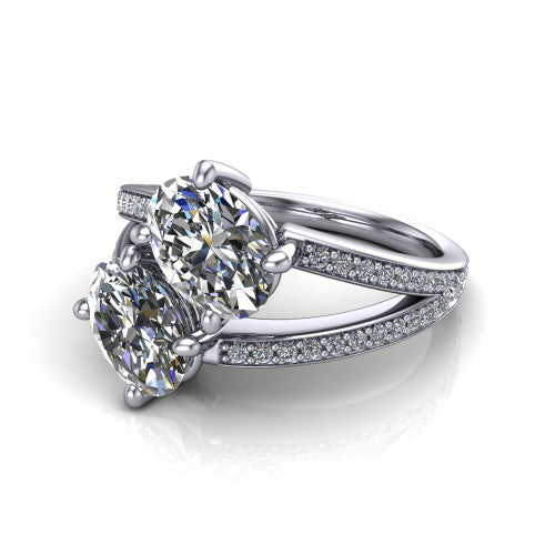 Malani oval three stone engagement ring in Platinum, three-quarter perspective showing two diamonds set corner to corner above a pav&eacute; split shank